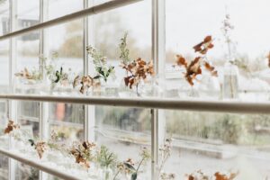 A window with a bunch of flowers in it