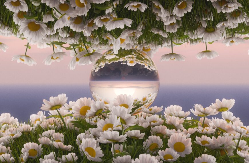 A flower vase reflects the ocean sunset.
