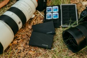 Camera equipment and storage devices on grass