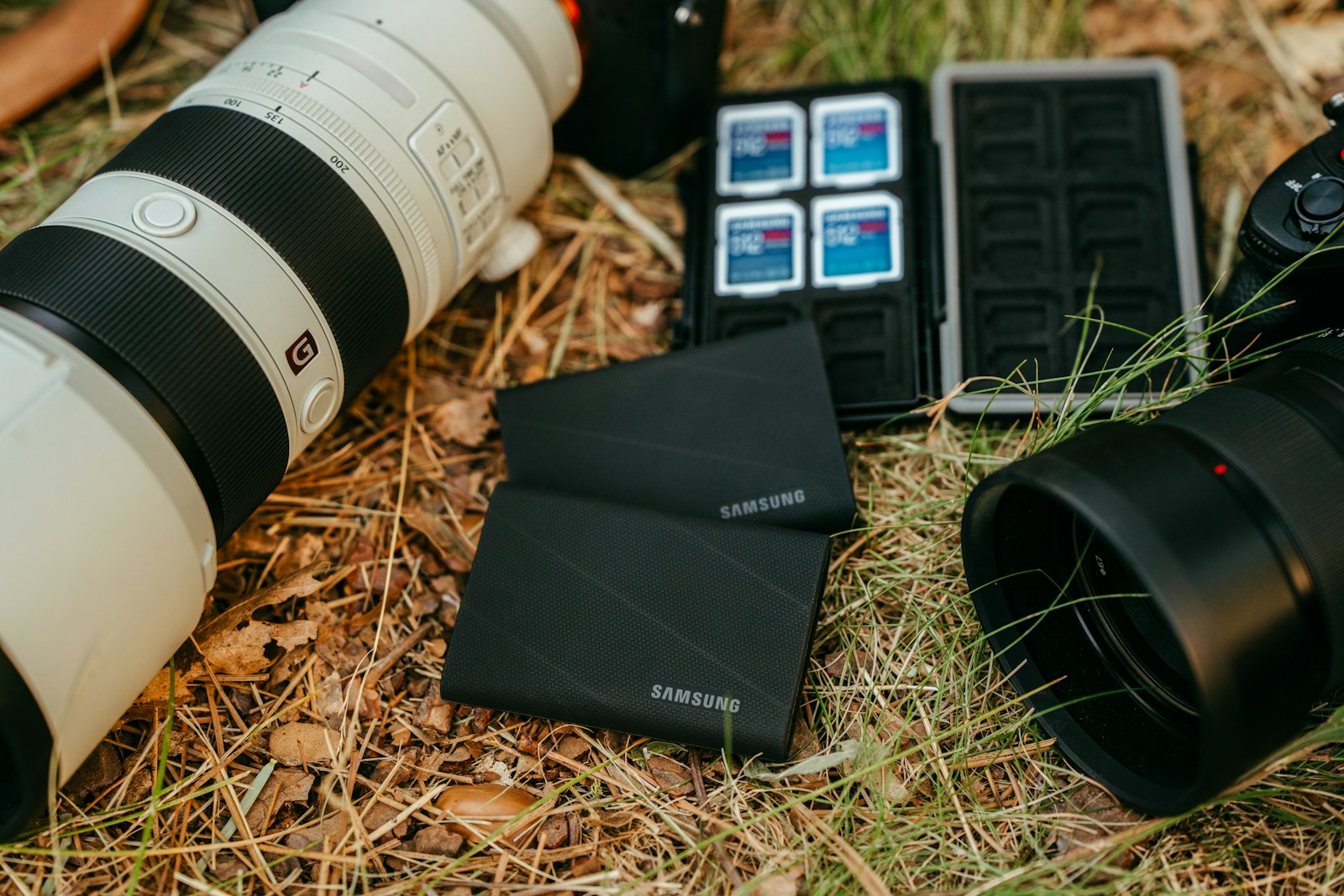 Camera equipment and storage devices on grass